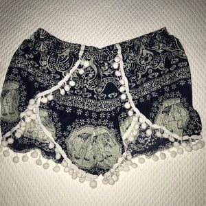 TWO pairs of flowy printed shorts